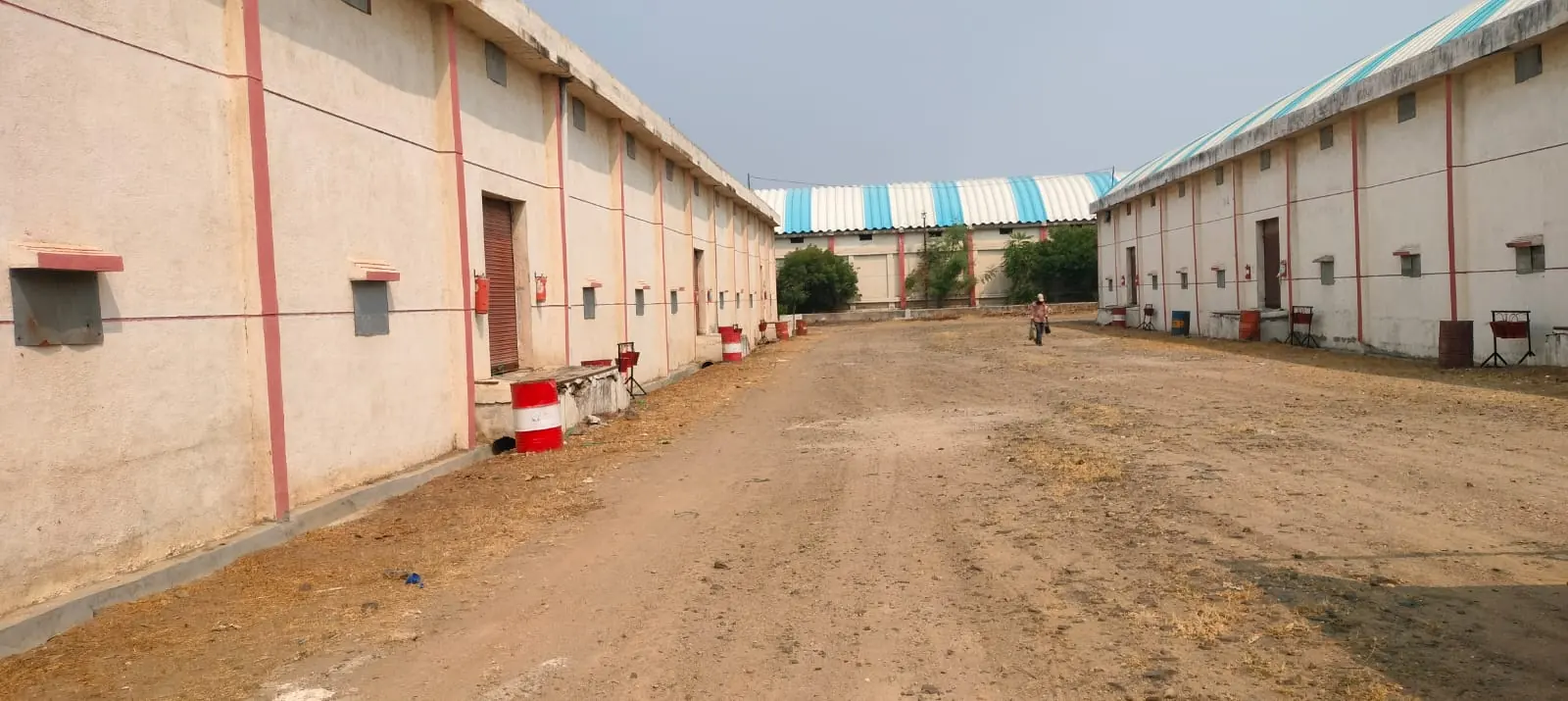 Open yard between two godown blocks with roller shutter doors